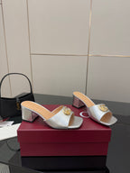 Gucci women's silver slide mules with gold logo detail and chunky block heel
