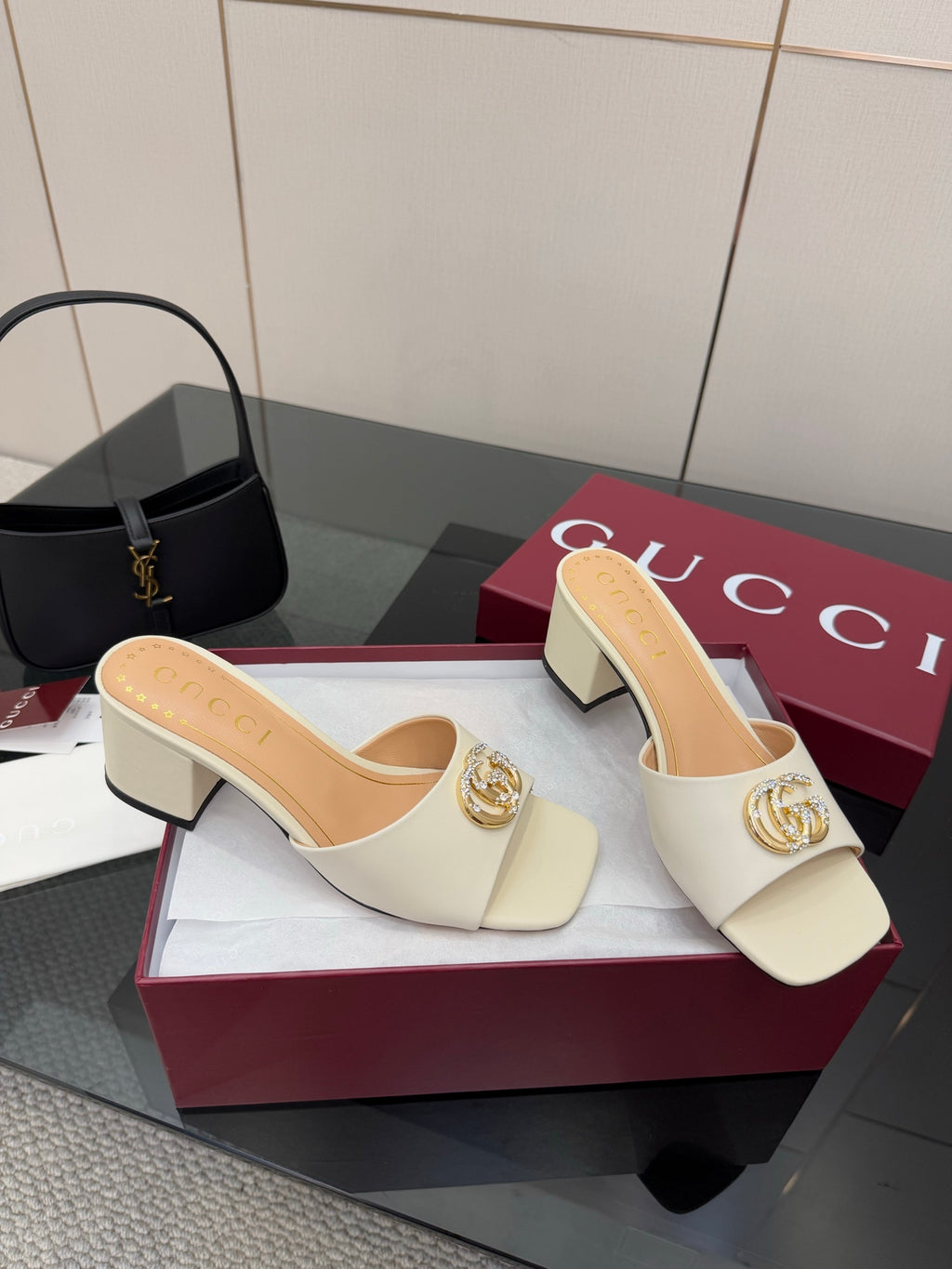 Gucci ladies cream open-toe mules with gold-tone logo buckle and block heel