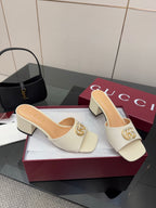 Gucci ladies cream open-toe mules with gold-tone logo buckle and block heel