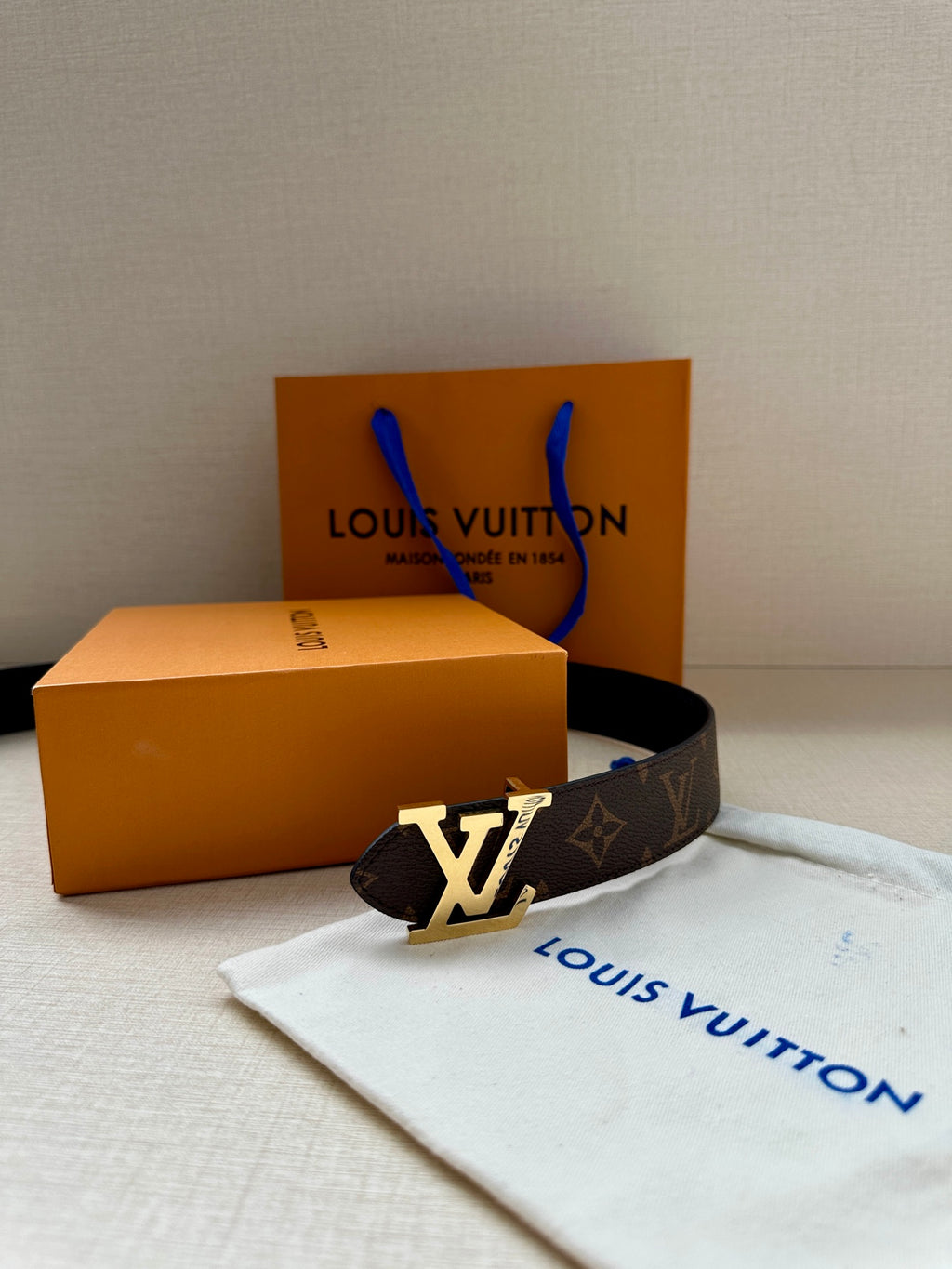 Monogram canvas belt with gold-tone LV buckle and dust bag