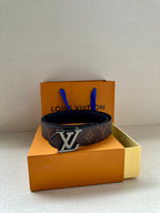Monogram canvas belt with oversized gold-tone LV buckle on box