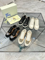 Burberry sneakers assortment, black and check styles with white and beige pairs