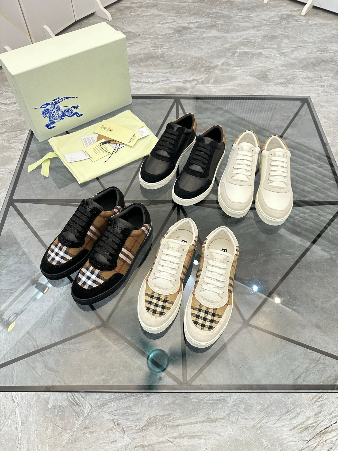 Burberry sneakers assortment, black and check styles with white and beige pairs