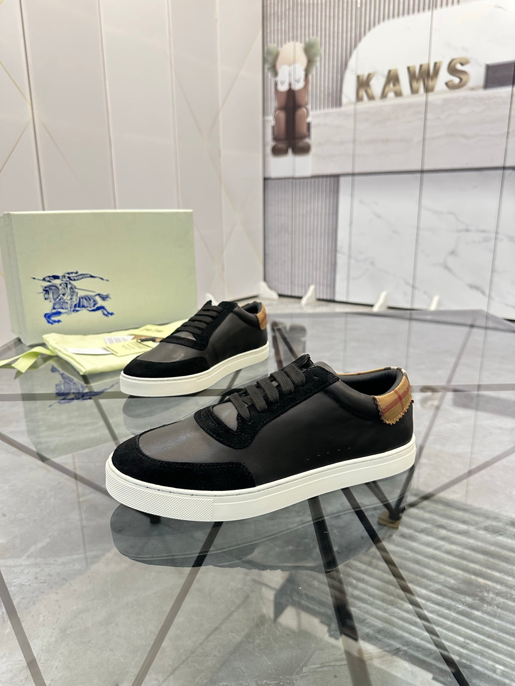 Burberry low-top sneakers, black leather upper with chunky white sole and lace-up detail