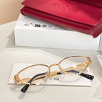 Gold round eyeglasses with clear lenses, black arms, and GG temple accents.