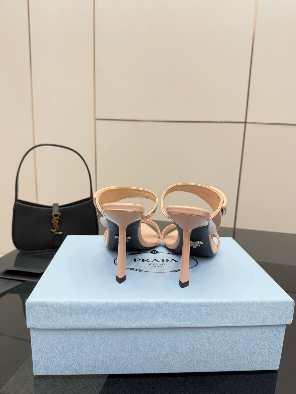 Prada women’s light beige heeled mules, heel and back view, pair