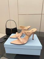 Prada women’s light beige heeled mules, cutout strap design, pair on box