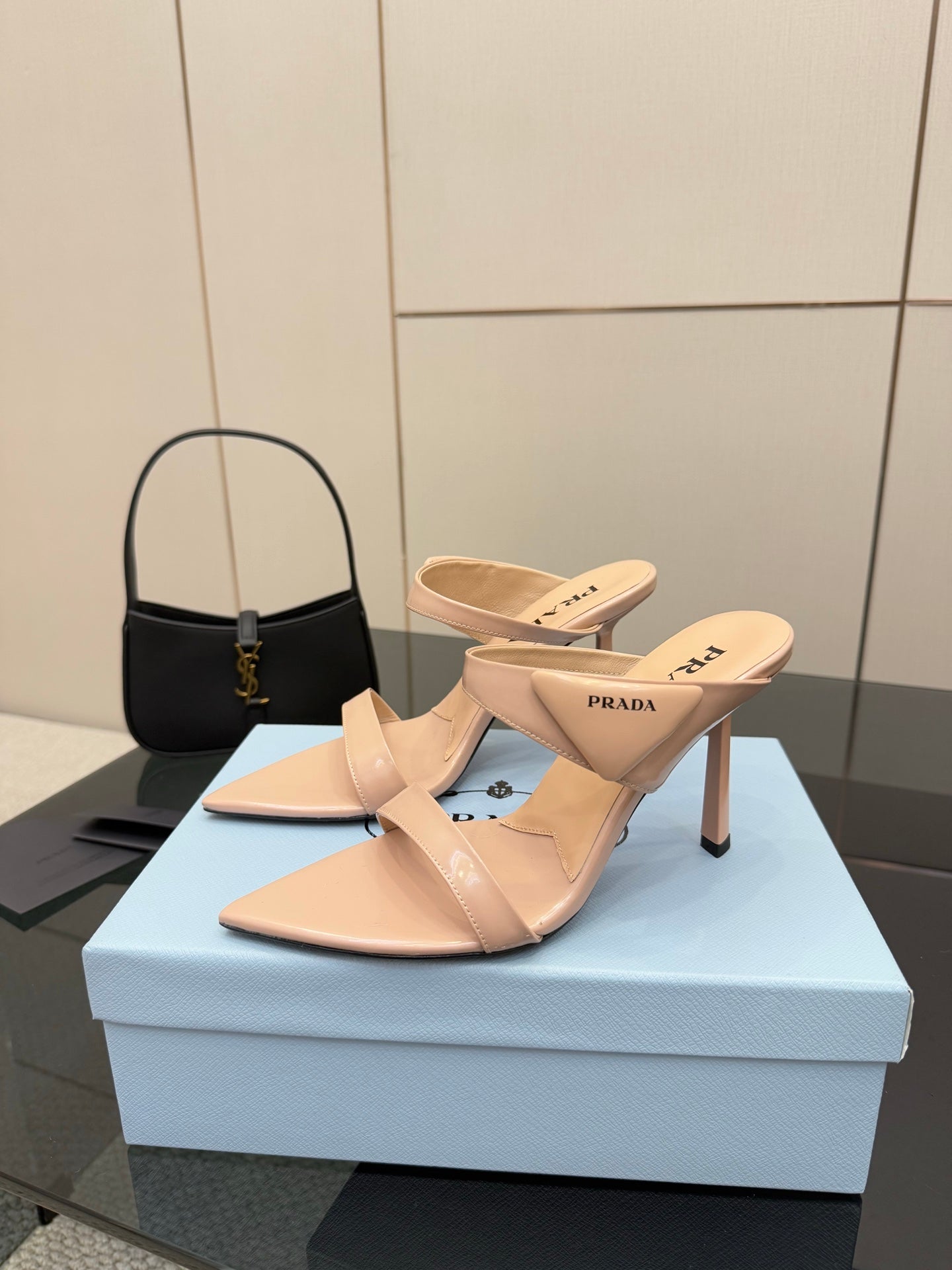Prada women’s light beige heeled mules, cutout strap design, pair on box