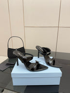 Prada black patent heeled mules with open toe and logo strap