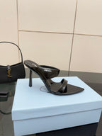 Prada black high-heel mule sandal with glossy strap and pointed toe