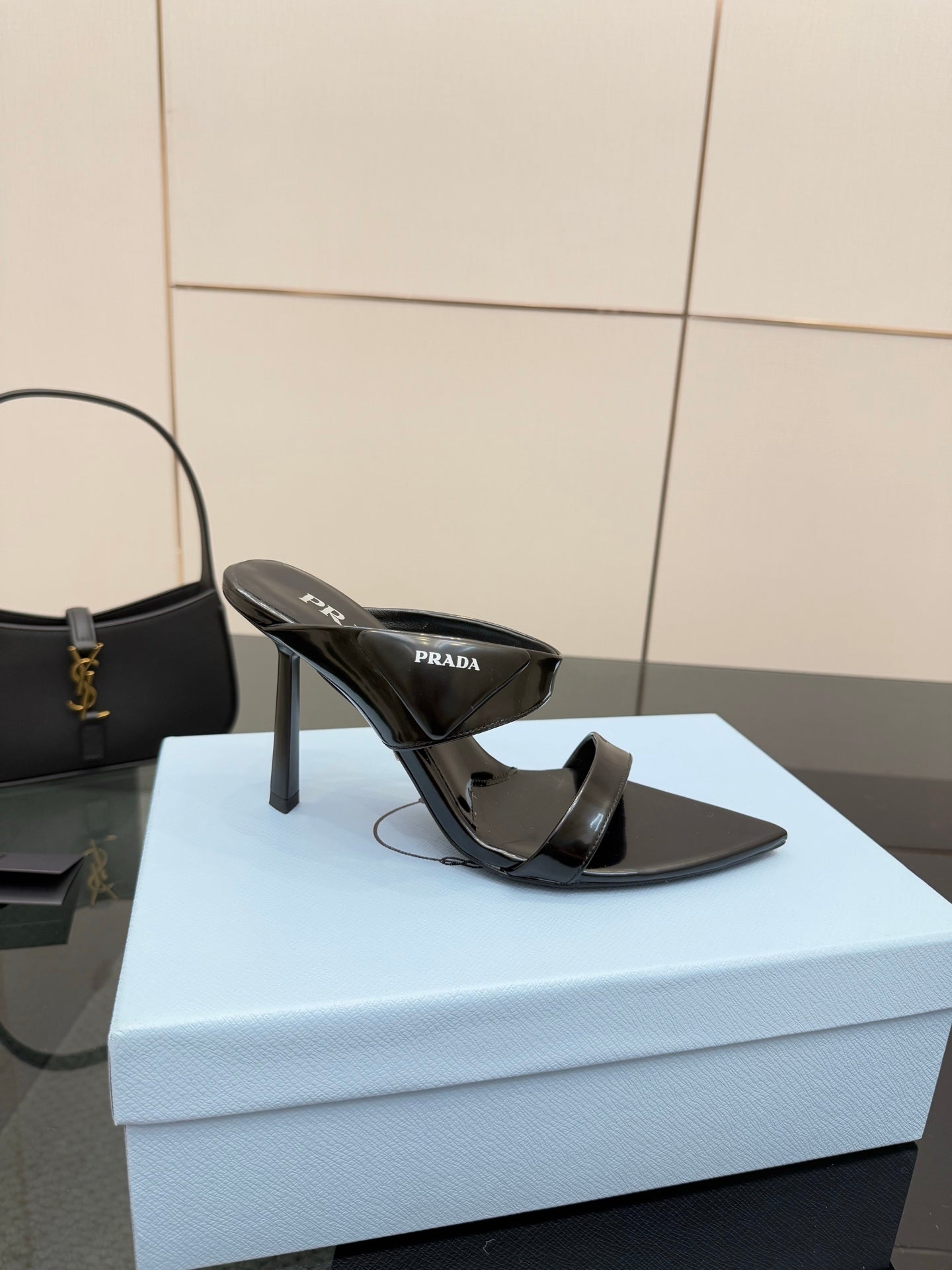 Prada black high-heel mule sandal with glossy strap and pointed toe