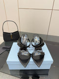 Prada black high-heel slide sandals with pointed toe and logo on strap