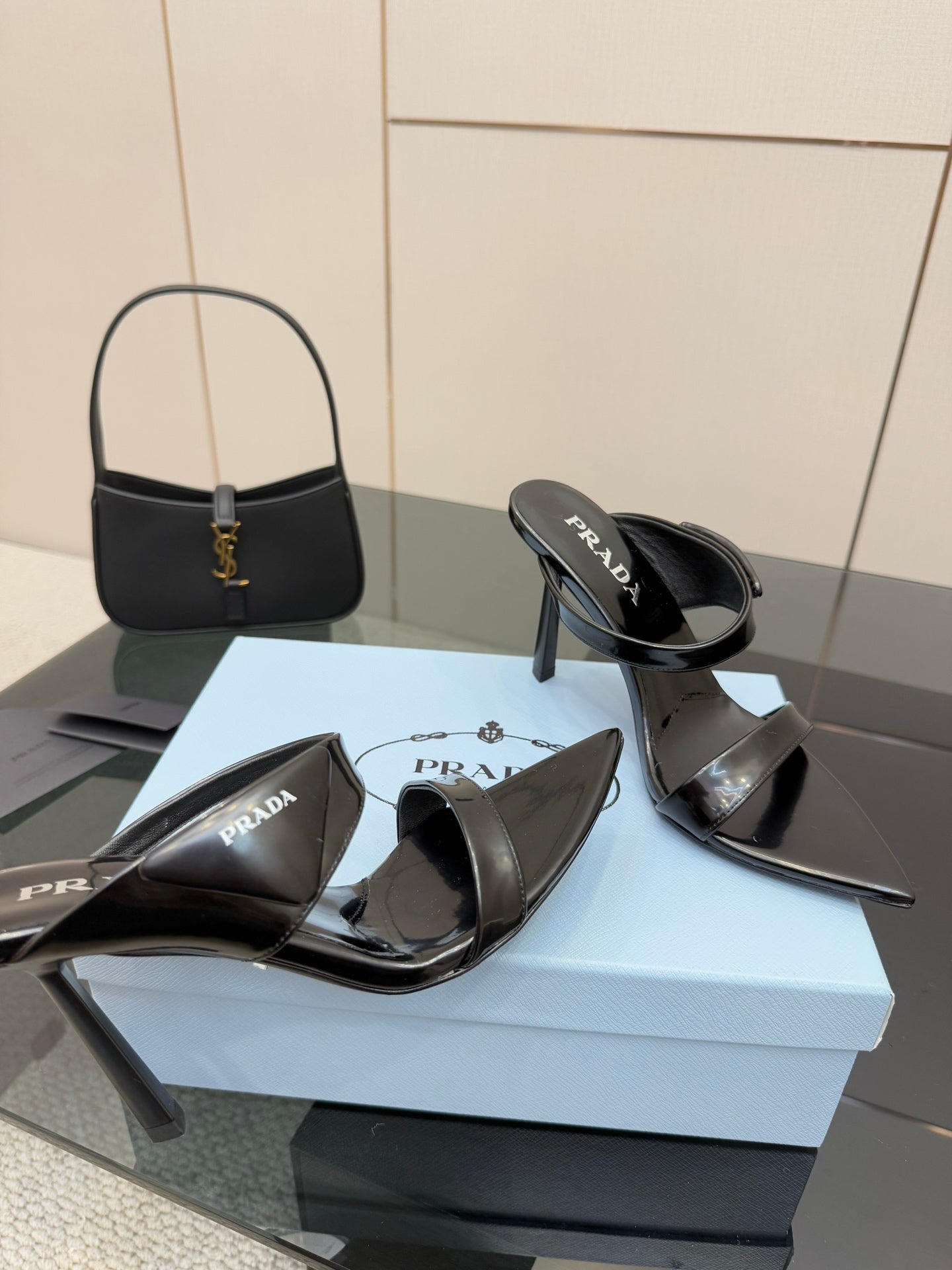 Prada black heeled mules with glossy straps and logo on footbed