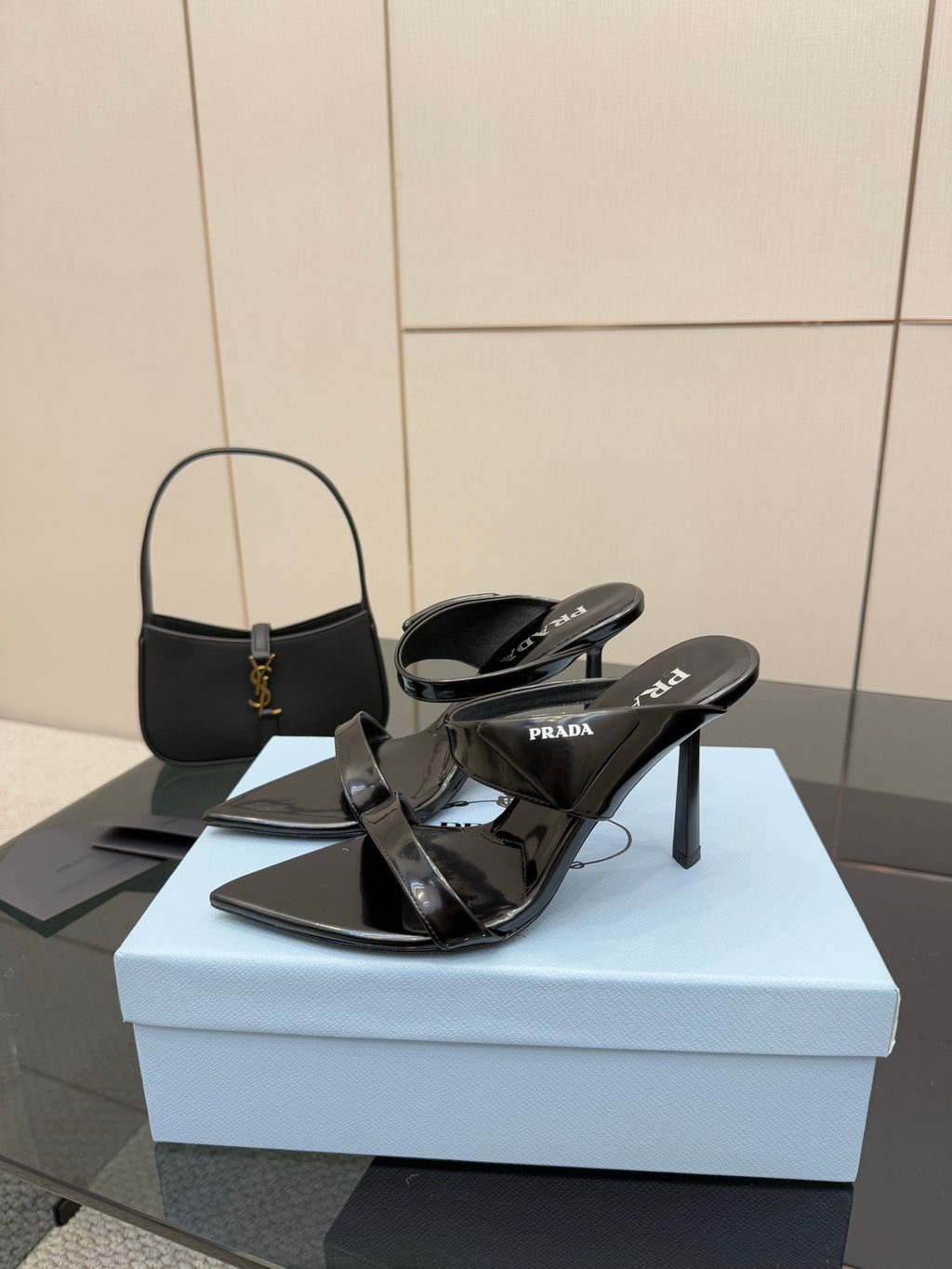 Prada black heeled sandals with slingback straps and pointed toe