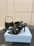 Prada black heeled sandals with slingback straps and pointed toe