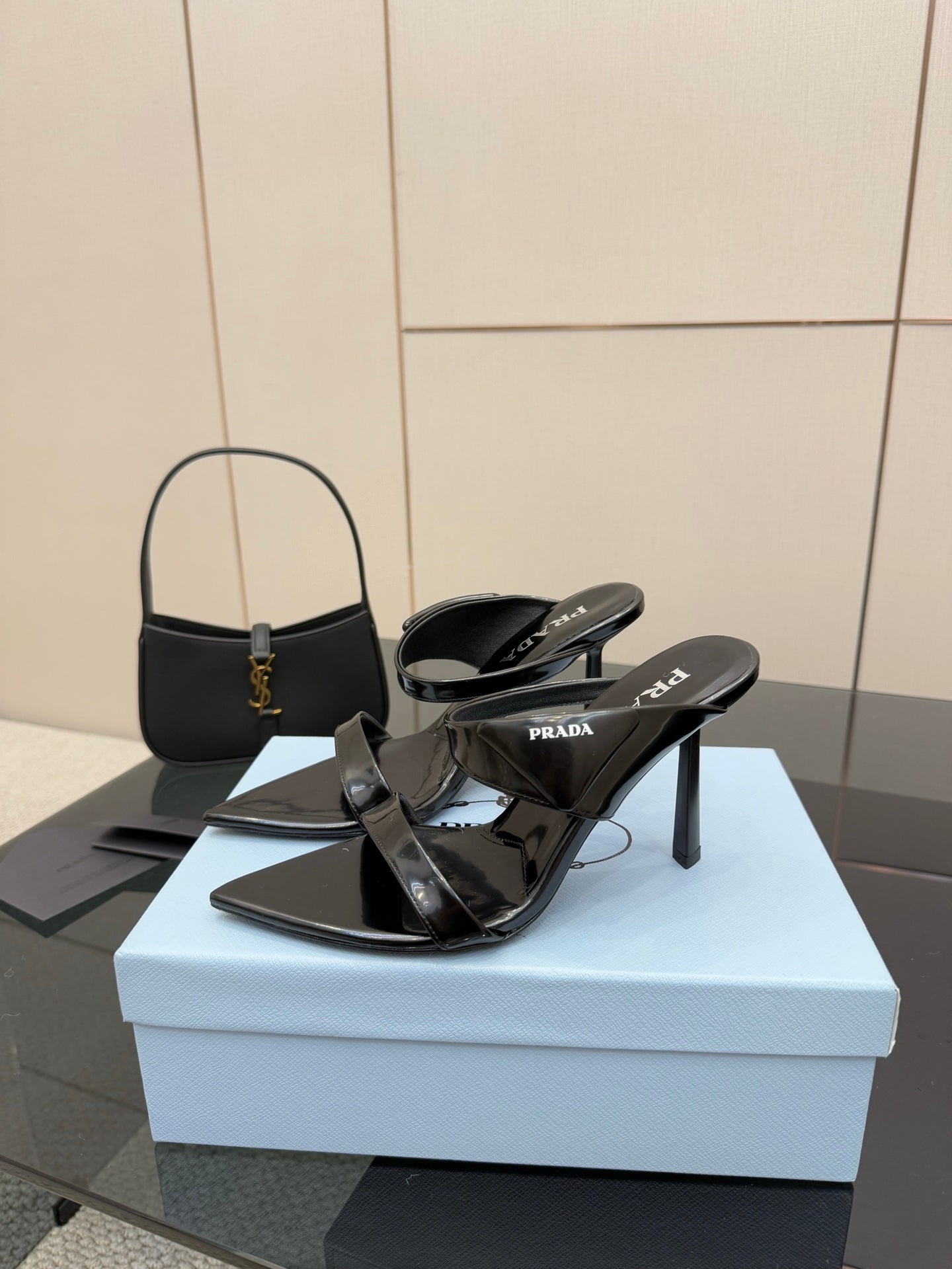 Prada black heeled sandals with slingback straps and pointed toe