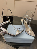 Prada women's metallic silver heeled sandals with ankle strap and pointed toe