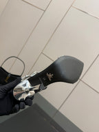 Prada women's metallic silver sandal outsole and heel, brand markings visible