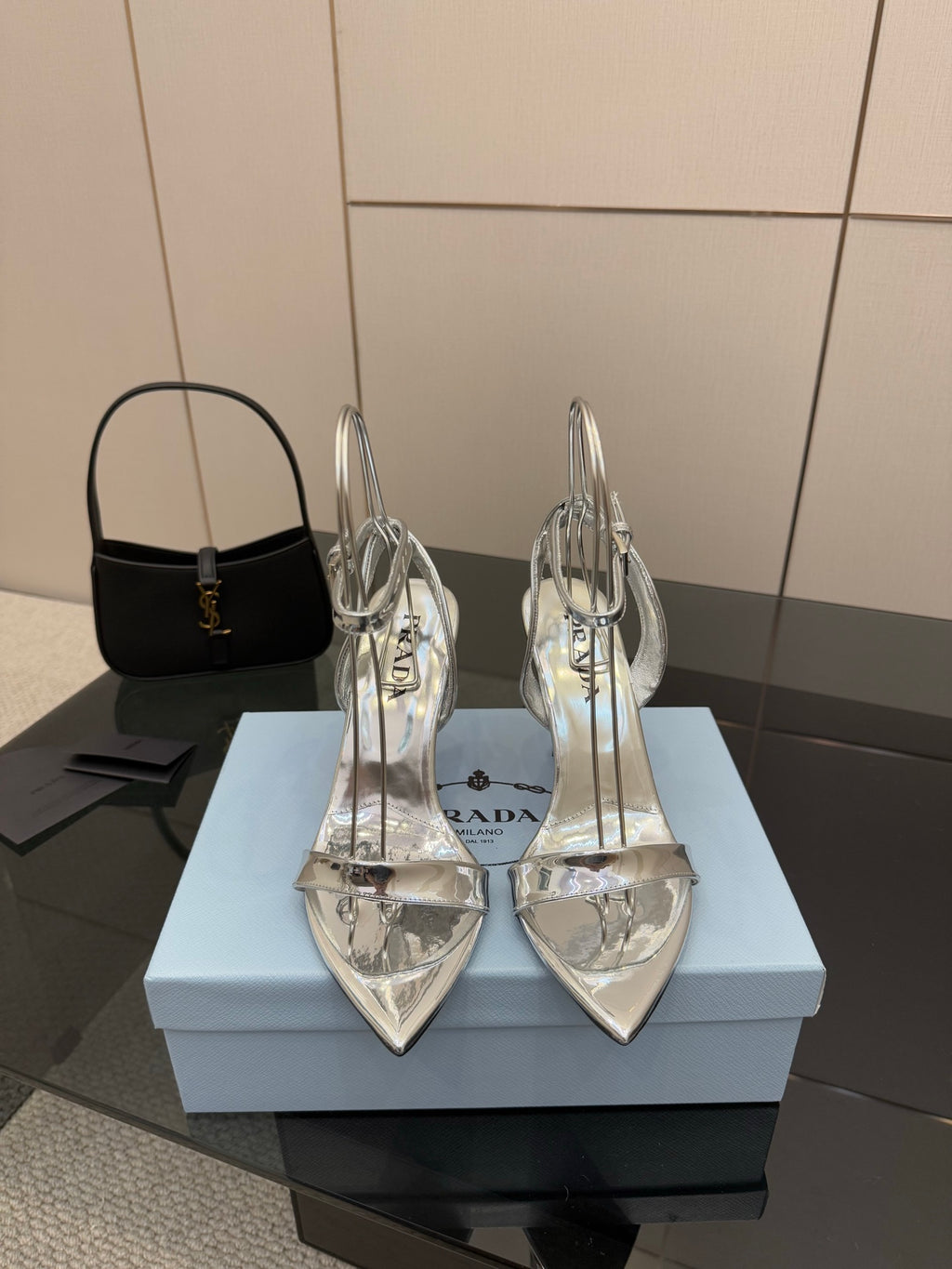 Prada women's metallic silver heeled sandals with thin straps and open toe
