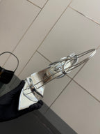 Prada women's metallic silver sandal with sling strap, close side view