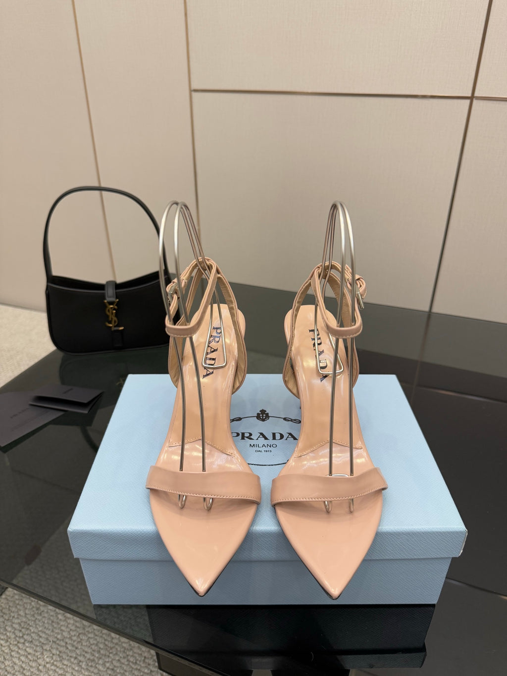 Prada high-heel sandals in light nude with pointed toe and ankle strap, stiletto heel