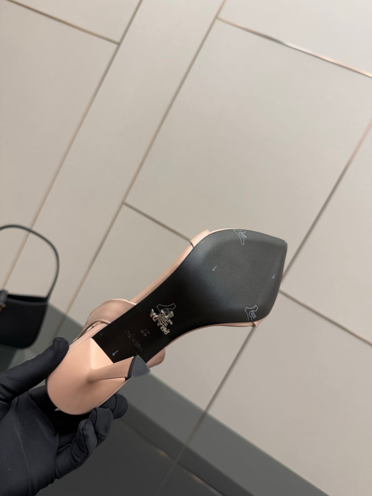 High-heel sandal sole in black with Prada logo and sculpted heel base