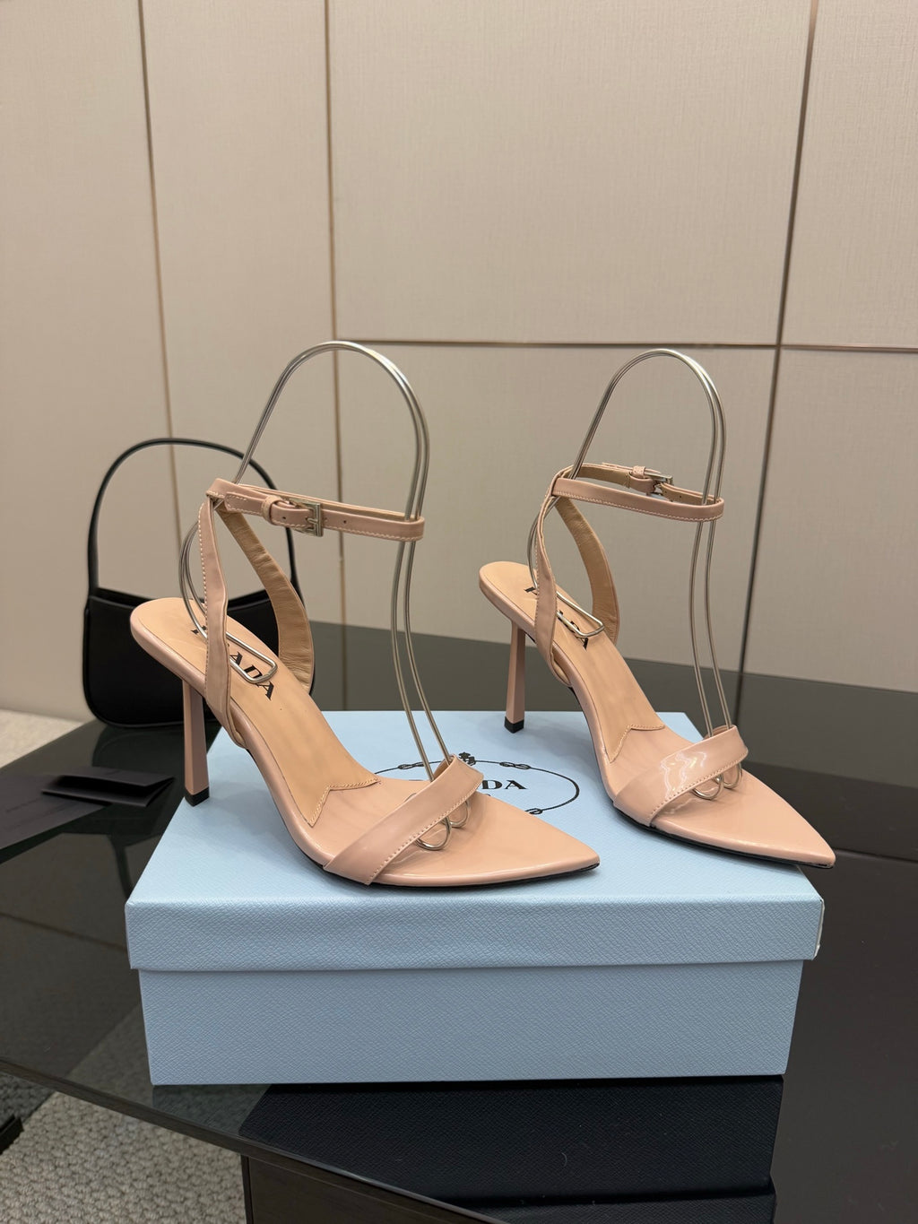High-heel sandals in light nude with thin ankle straps, pointed toe, stiletto heel