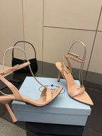 High-heel sandals with light nude pointed toe, cross ankle straps, slim stiletto heels