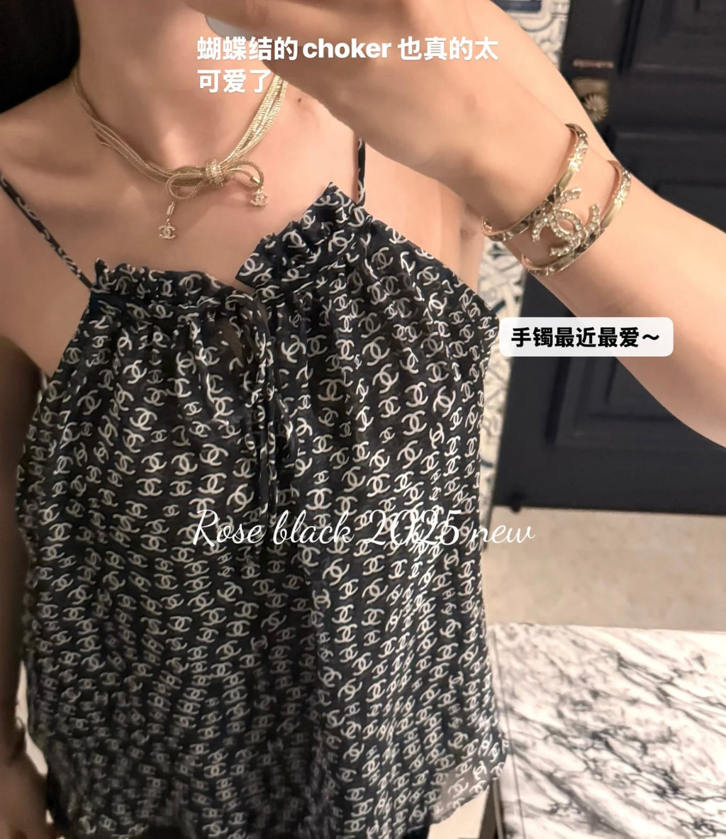 Silver-tone chain choker and layered bracelets with Chanel logo motif