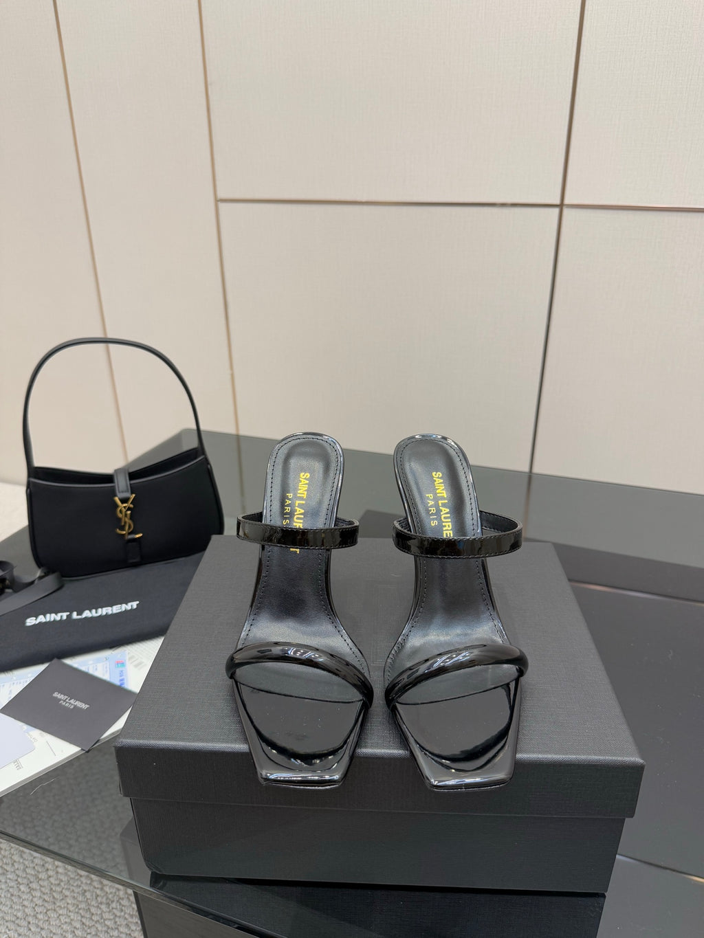Black patent heeled mules with clear toe strap and ankle wrap detail