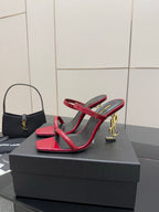 YSL ladies heeled sandals, front view, red and black straps with gold YSL emblem