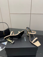 Two-tone heeled sandals with black footbed and beige V-shaped toe strap