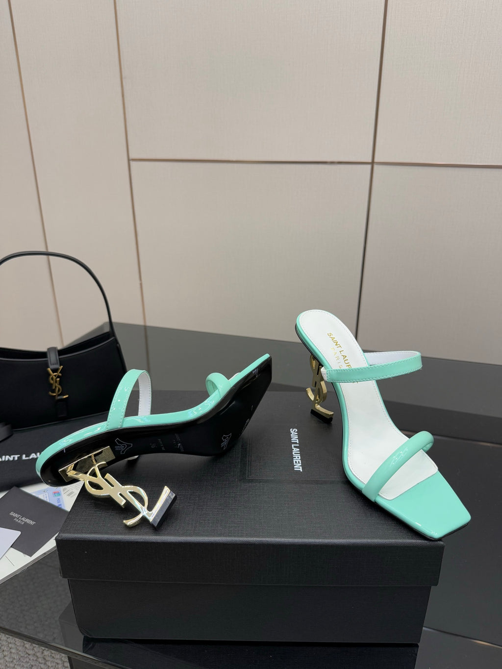 Heeled sandals in mint green and black with contrasting logo embellishment