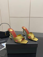 Yellow slide mule sandals with red insole and gold logo heel, open toe