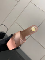 Pink YSL logo slide sandals, top view of open toe mule with low heel