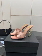 Pink YSL logo mule sandals, open toe with wide crossover straps and low heel