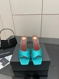 Teal YSL mule sandal with open toe and block heel, gold logo detail on heel