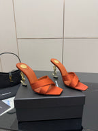 YSL orange mule sandals, open toe and ankle strap with gold logo detail on the heel
