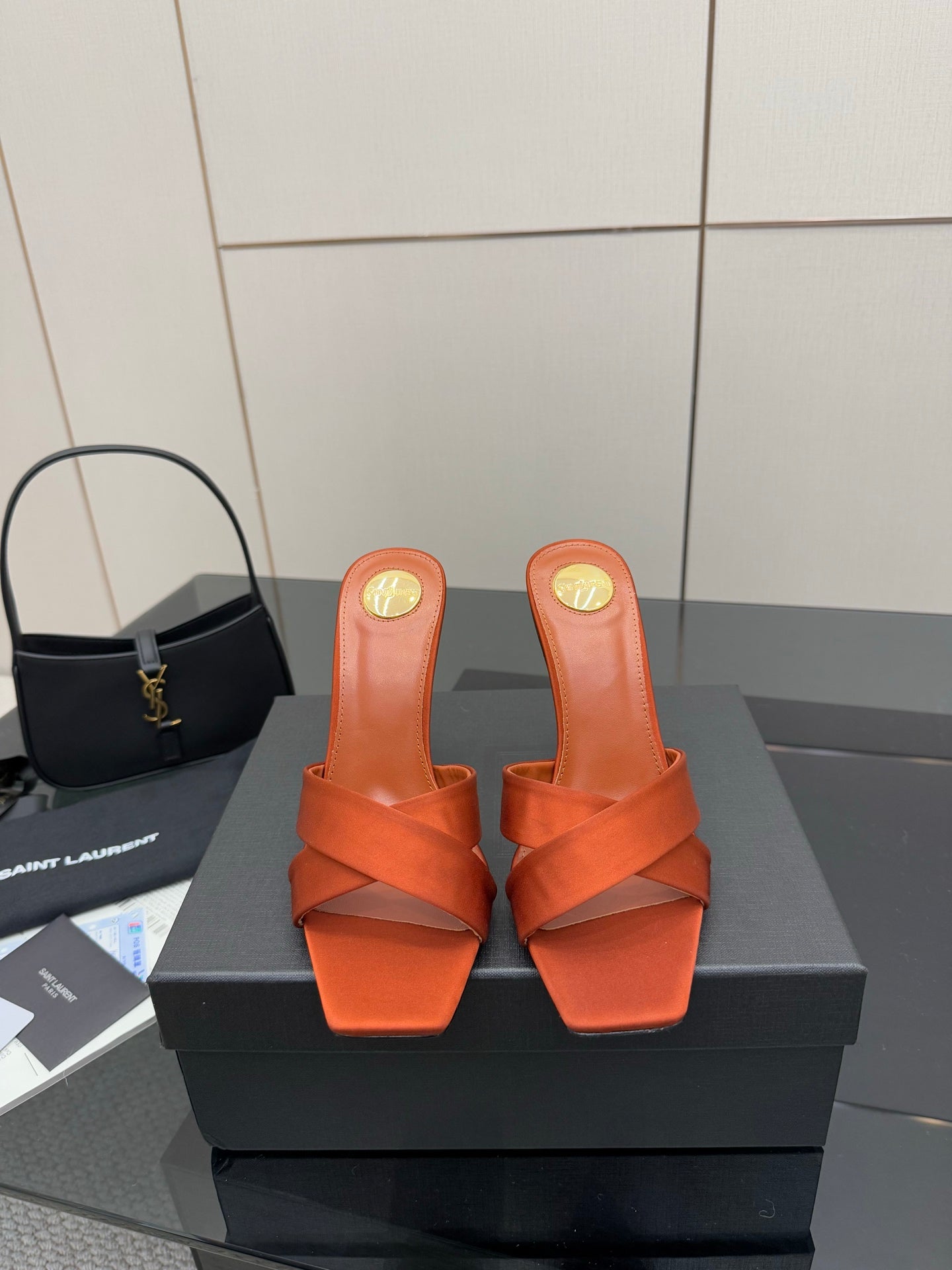 YSL mule sandals in orange, open toe with crisscross strap and sculpted high block heel
