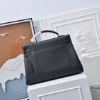 Black leather handbag with top handle, front panel detail and silver clasp hardware