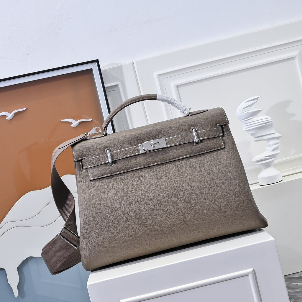 Hermes handbag in taupe textured leather, front flap with clasp and top handles