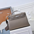 Hermes handbag in taupe textured leather, front flap with clasp and top handles