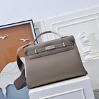 Hermes handbag in taupe textured leather, front flap with clasp and top handles