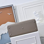 Hermes handbag in taupe textured leather, wide front flap with metal studs