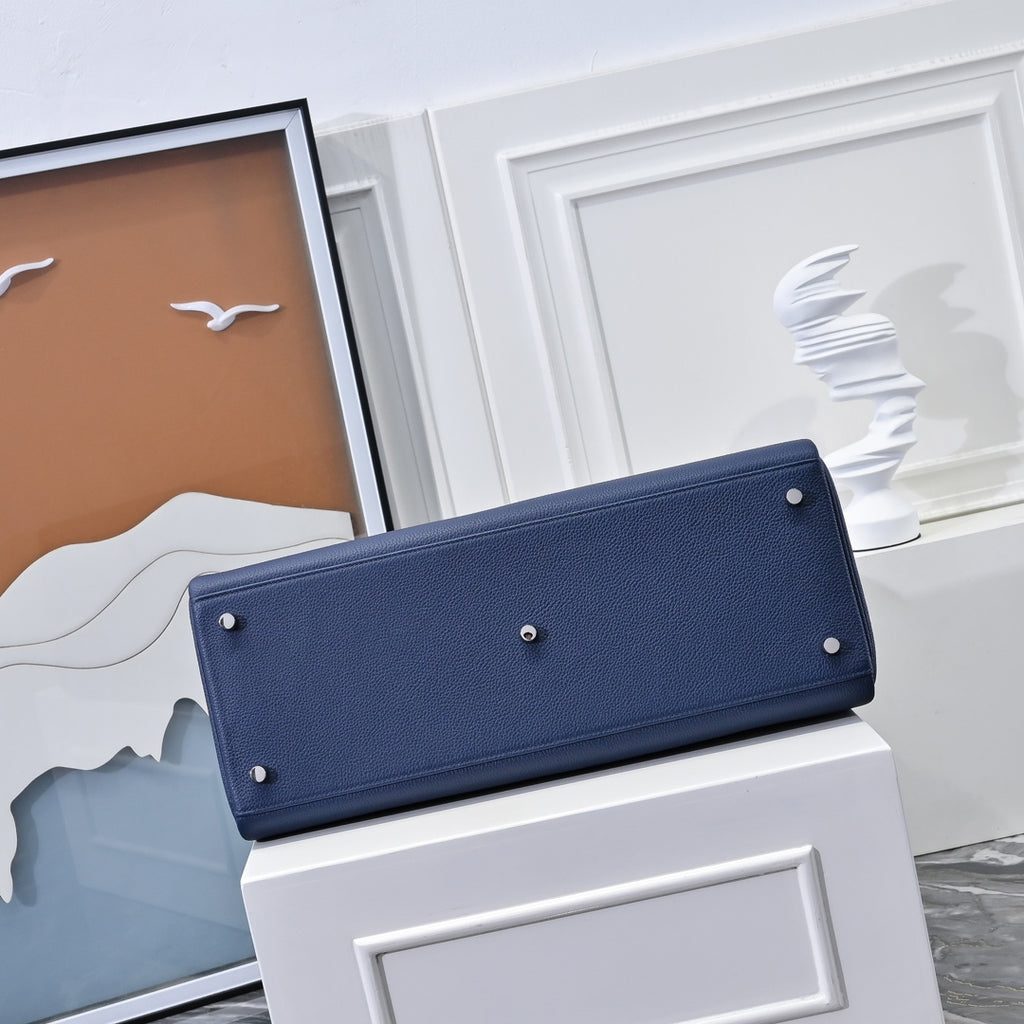 Hermes bag back in dark blue leather with long strap flap and metal rivets
