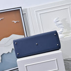 Hermes bag back in dark blue leather with long strap flap and metal rivets