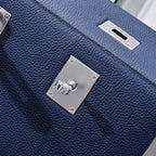 Hermes bag dark blue leather with front flap turn-lock and shiny metal square plates
