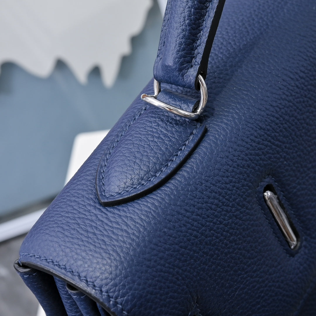 Hermes bag dark blue leather corner with metal strap ring and textured grain