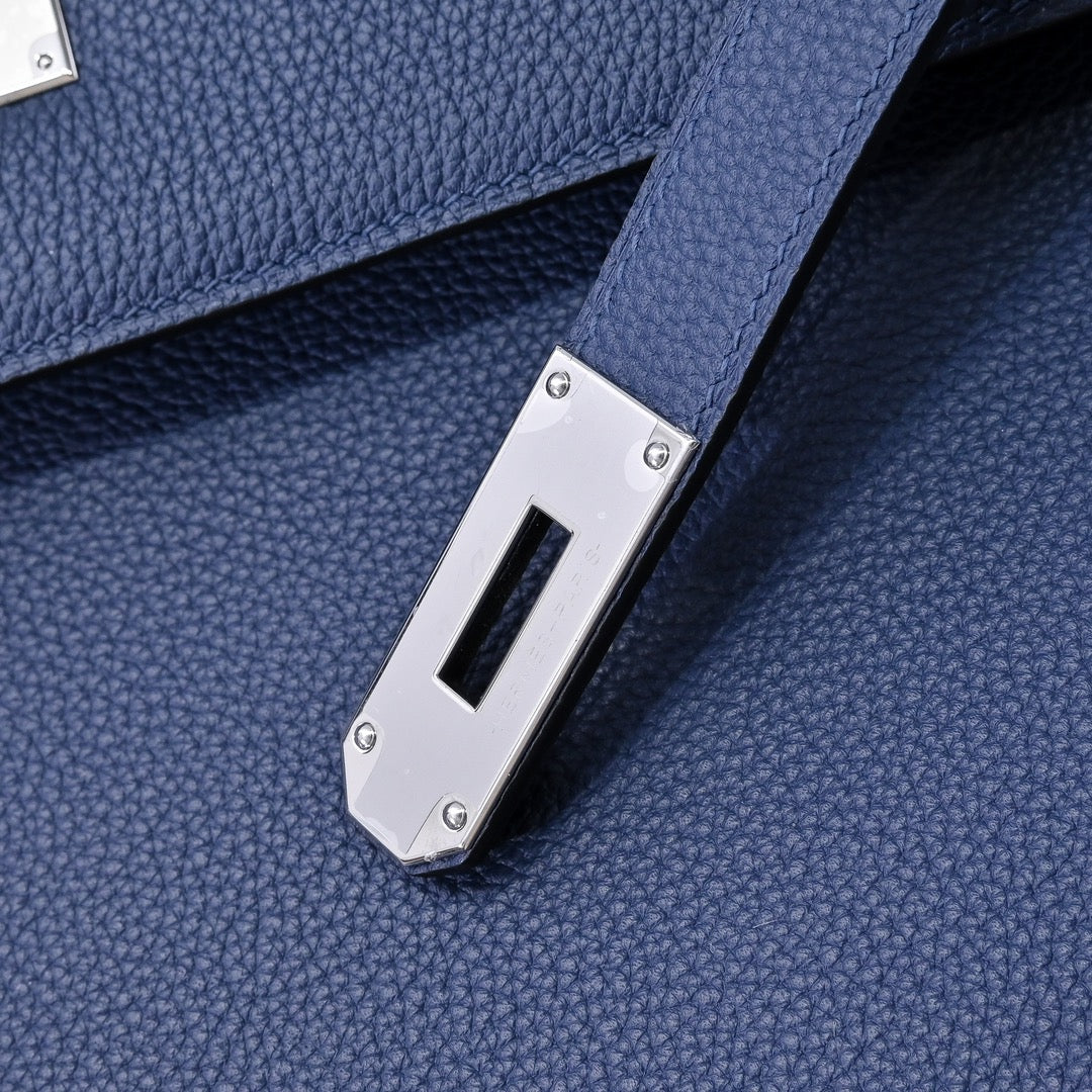 Hermes bag dark blue leather with silver hardware plate and strap attachment