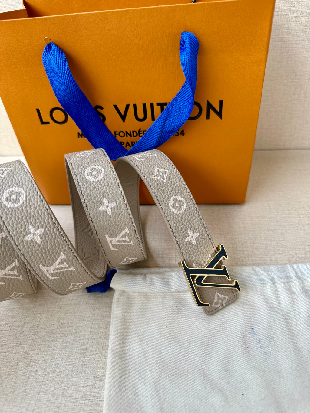 Gray monogram belt with LV buckle detail, end holes and keeper loop